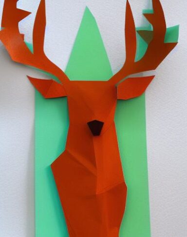 A deer in a forest paper cut