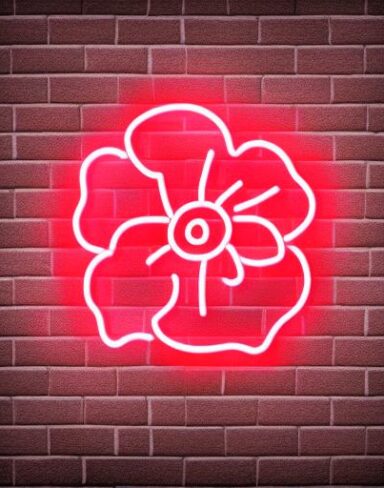 A flower symbol neon sign on a brick wall
