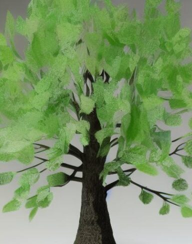 A paper sculpture of a tree with green leaves
