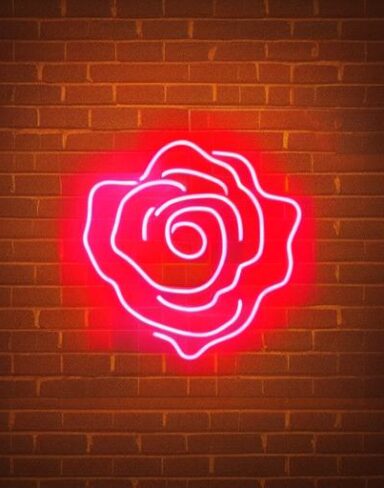 Flower neon sign on the brick wall