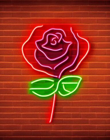 A rose neon sign on a brick wall