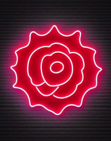 A flower symbol neon sign on a wall
