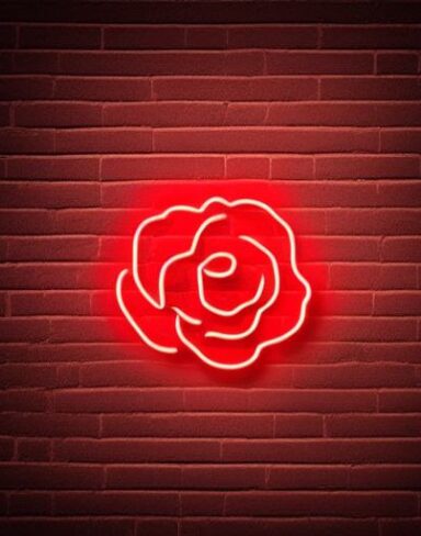 A red flower neon sign on the brick wall