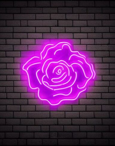 A glowing purple flower neon sign on a brick wall