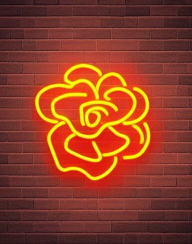 A yellow flower neon sign on a brick wall