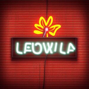 A flower neon sign on a brick wall