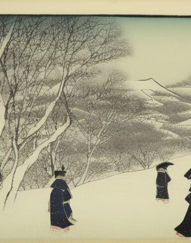 A couple of people walking down a snow covered street