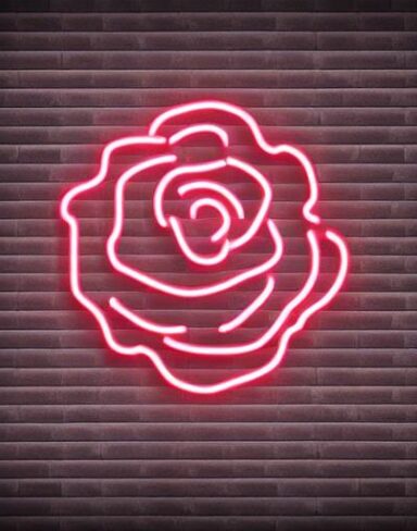 Simple flower neon sign on a brick wall