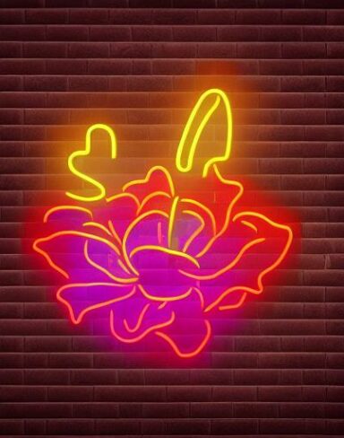 Some flowers neon sign on a brick wall
