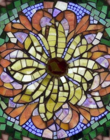 A close up of a flower on the mosaic