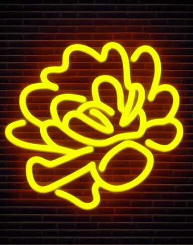A yellow flower neon sign on a wall