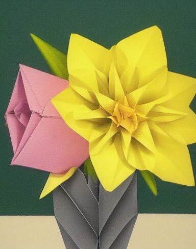 Several paper flowers in a pot