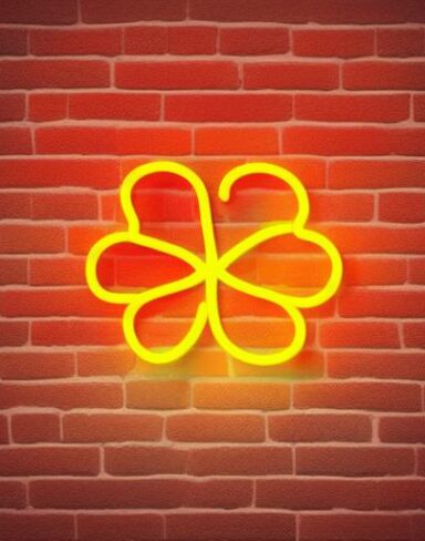 A yellow flower neon sign on a brick wall