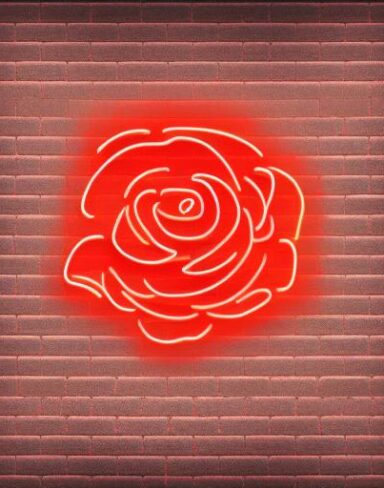 Simple flower neon sign on a brick wall