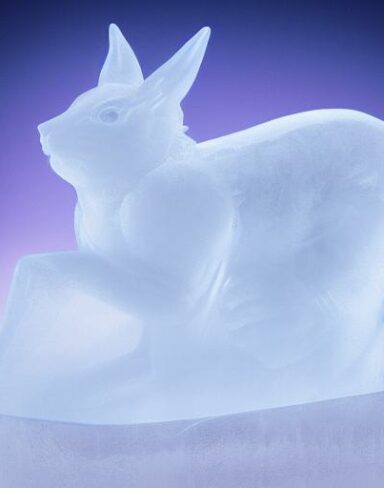 An ice sculpture of rabbit in the snow