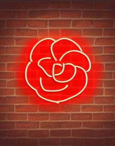 A red flower neon sign on a brick wall