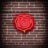 Flower neon sign on a brick wall Flower neon sign on a brick wall