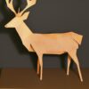 Paper cut of a deer in a forest Paper cut of a deer in a forest